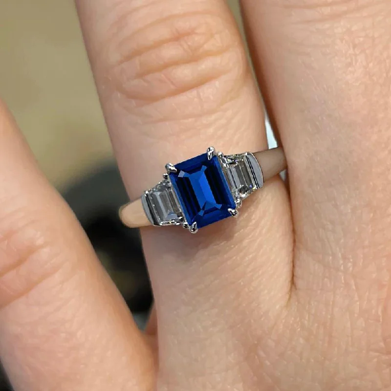 handmade engagement rings-2.30 Carat Emerald Shape Three Stone Blue Sapphire Engagement Ring