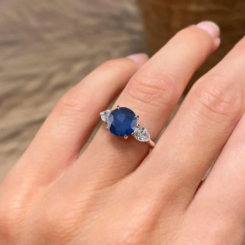 rose gold wedding rings-3.10 Carat Round Shape Three Stone Blue Sapphire Engagement Ring